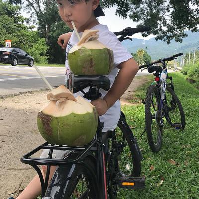 Taking a break while cycling and enjoying some refreshing coconut water.