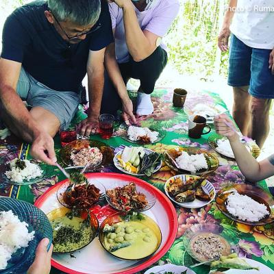 Digging in a traditional kampung feast.